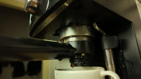 Leaky coffee from a lever coffee machine. The concept of a broken coffee machine Stock Footage 276543813