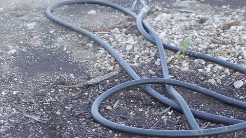 Leaky valve in arid fields wasting water Stock Footage 77956055