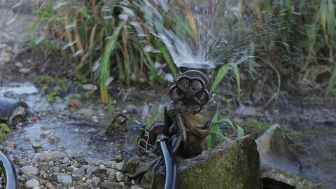 Leaky valve in arid fields wasting water Stock Footage 77957782