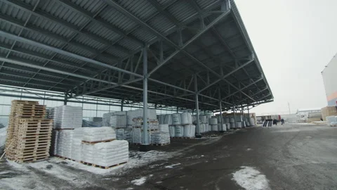 Lean-to above packages of building materials in warehouse Stock Footage 231719016