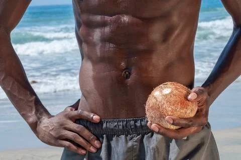 Lean abs and coconut Stock Photos