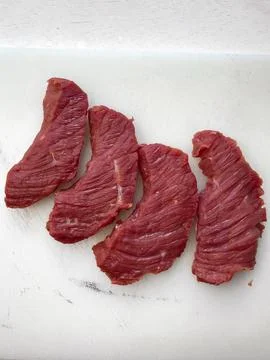 Lean raw beef displayed on white Stock Photos