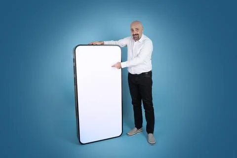 Leaning big smartphone with empty white screen for mock up. Blue background. Stock Photos
