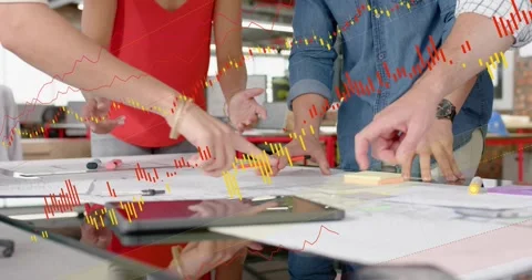 Leaning colleagues pointing, tracing and deciding plans at design table, tablet Stock Footage 334308260