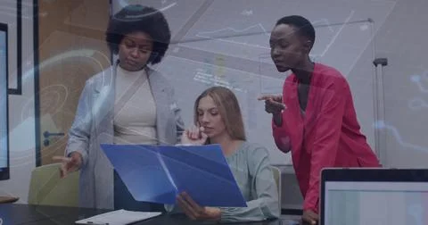 Leaning colleagues studying blue folder at conference table, with laptops, Stock Photos