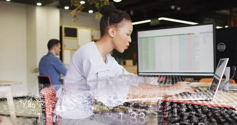 Leaning forward woman typing spreadsheet data while floating numbers indicating Stock Footage 315540211