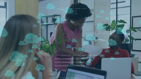 Leaning lead handing doc to peer, blonde reaching and accepting, cloud code Stock Footage 334728630