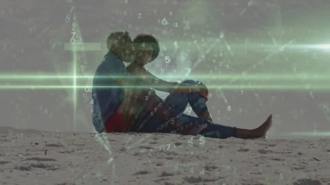 Leaning man initiating kiss while holding woman on sandy shore, green flares and Stock Footage 331593562