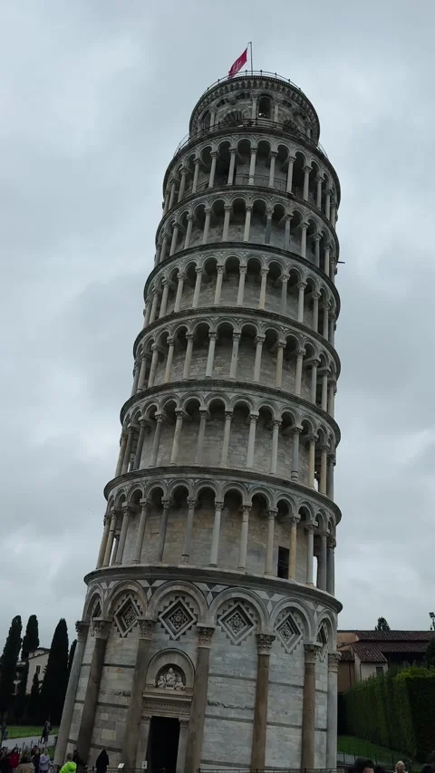 Leaning Tower of Pisa stands tall with the city flag flying at the top Stock Footage 308241538