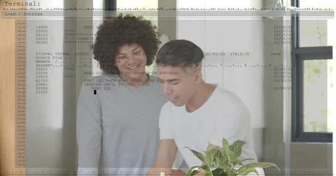 Leaning two men studying code on table at home office, wearing shirts with Stockfoto's