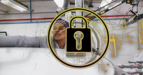 Leaning worker in coat, patterned scarf inspecting white roll on factory line, Stock Photos