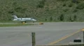 Learjet 31A taxis down runway to takeoff point and flies away - series - 4 HD Footage