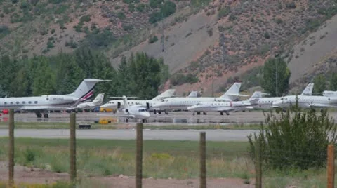 Learjet 31A taxis down runway to takeoff point and flies away - series - 1 Video stock 11981389
