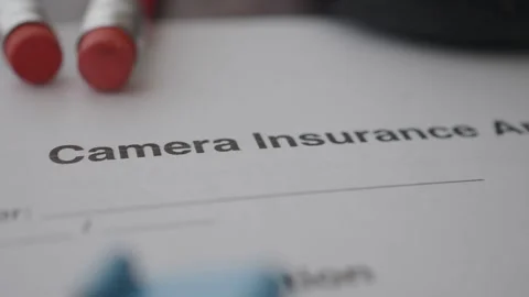 Learn about camera insurance application process Stock Footage 330320098