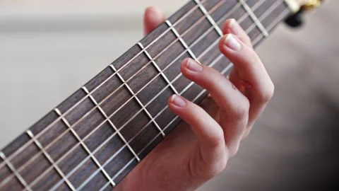 Learn basic guitar chords in a simple way at home 스톡 동영상 332469679