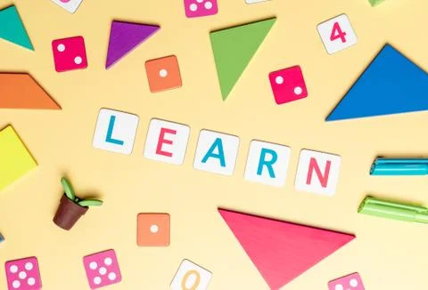 Learn with colorful toy and objects for child education concept on yellow bac 库存照片