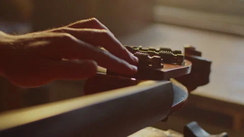 Learn effective methods for tuning bass string tuning keys in detail Stock Footage 319921476