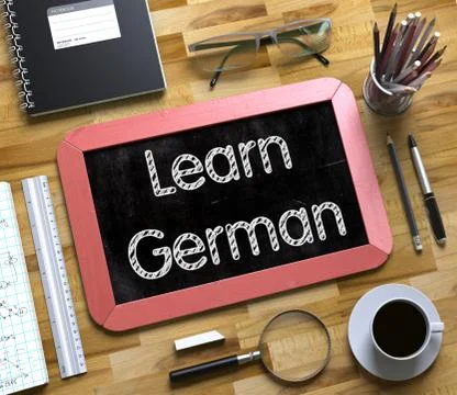 Learn German Handwritten on Small Chalkboard. 3D. Stock Illustration