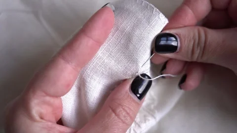 Learn hand embroidery techniques with a detailed guide on stitching fabric Stock Footage 306223527