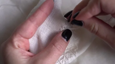 Learn hand sewing techniques with a detailed guide on stitching fabric Video stock 289548862
