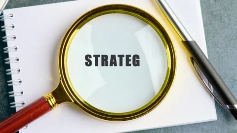 Learn how to define strategy step by step with a magnifying glass view on the Stock Footage 339293182