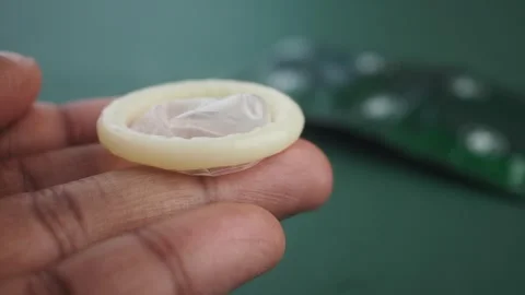 Learn how to properly use a condom for safe practices Stock Footage 313911864