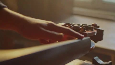 Learn how to tune bass string tuning keys in simple steps easily Stock Footage 319921222
