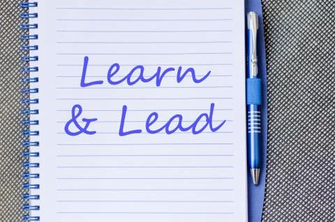 Learn &amp; Lead write on notebook Stock Photos