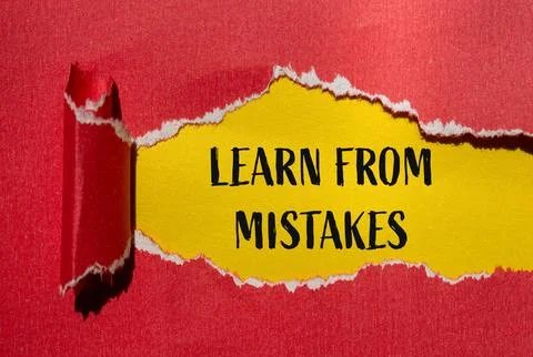 Learn from mistakes message written on ripped torn red paper with yellow back Stock Photos