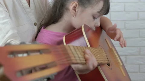 Learn to play on guitar. Stock Footage 138873270
