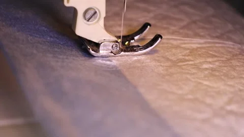 Learn sewing techniques with a sewing machine in a workshop setting Stock Footage 328178635