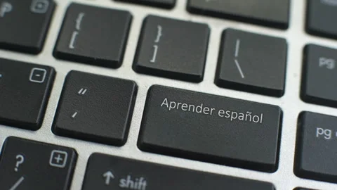Learn Spanish button on computer keyboard, female hand fingers press key Stock Footage 97828777