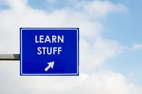 Learn Stuff words displayed on blue road sign Stock Photos