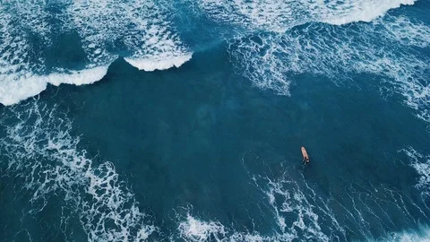 Learn surfing, surfer beginner learner trying ocean waves, drone view Stock Footage 107867818