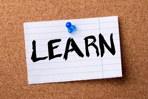 LEARN - teared note paper  pinned on bulletin board Stock Photos