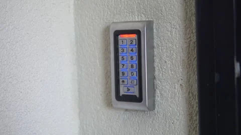 Learn to use a keypad entry system for secure access Stock Footage 318049957