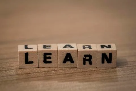 Learn in wooden cubes Stock Photos