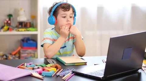 Learn on your schedule. Distance learning online education. A schoolboy boy 스톡 사진