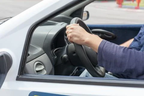 Learner driver driving car with instructor Stock Photos