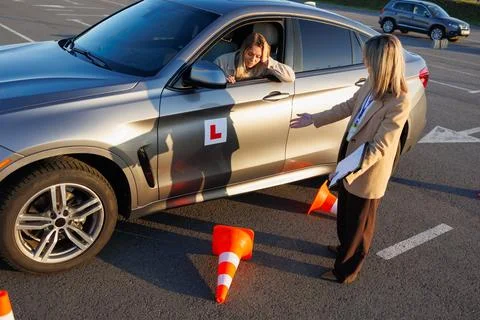 Learner Driver Reacting to Mistake as Instructor Explains Driving Error Stock Photos