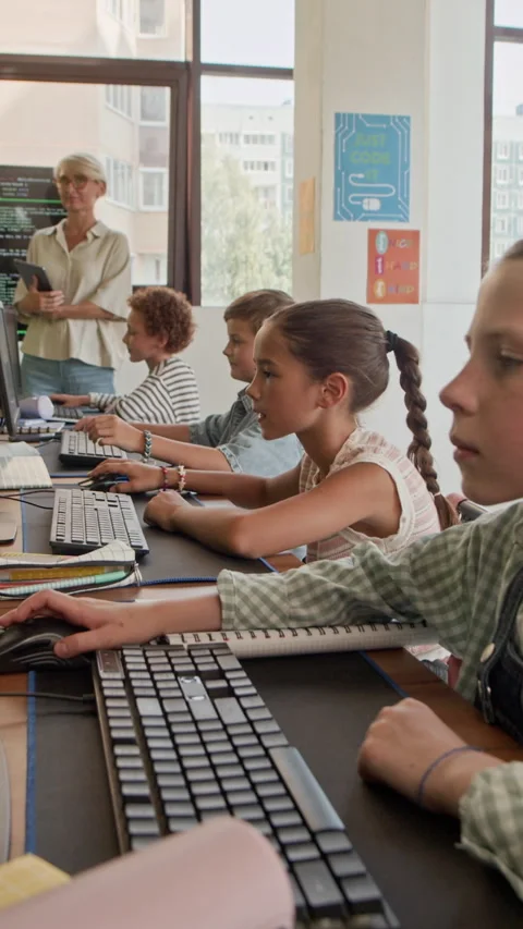 Learners Working with Computers and Raising Hands to Answer Question Stock Footage 316484033