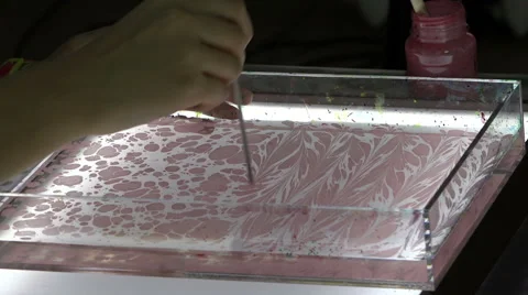 Learning the art to create a vivid picture with paint and water Stock Footage 42341071