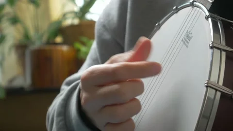 Learning banjo at home Stock Footage 141386239