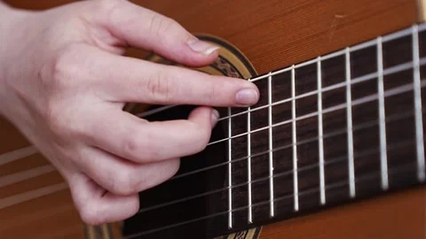 Learning basic guitar techniques step by step 스톡 동영상 332469721