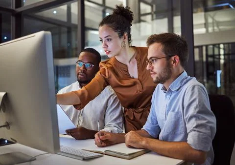 Learning, computer and training business interns in night office with manager Stock Photos