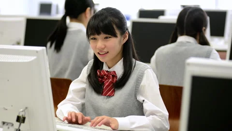 Learning with a Computer: A Female Student's Journey Stock Footage 332541480