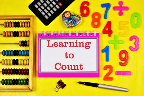 Learning to count-the inscription of the text in the student's task book. Stock Photos