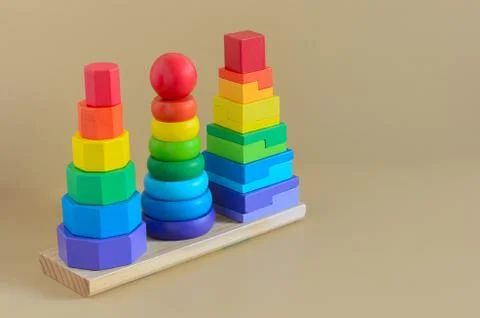 Learning developmental kids toy.  Geometric stacker, organic wooden baby toy. Stock Photos