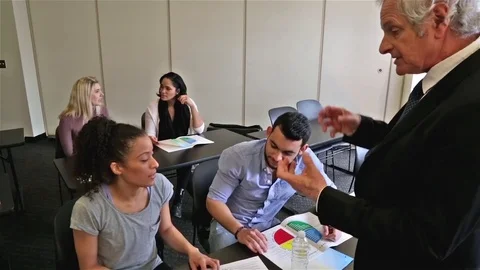 Learning Education Diversity Teacher Interacting With Creative Students in Class Stock Footage 80166056