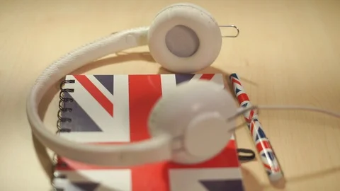 Learning english courses logo concept with british flag and headphones. English Stock Footage 85579645